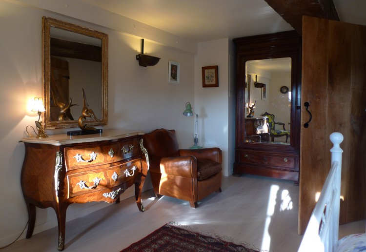 antique french commode in the bedroom